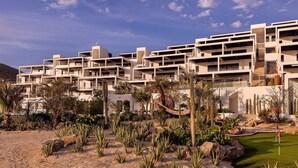 A modern hotel with multiple balconies and a desert garden. - Oceanfront 2BR • Elevated Views • Large Terrace (Los Cerritos)