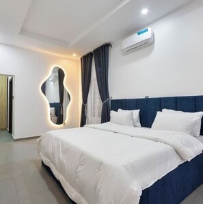 Deluxe Apartment, Balcony, City View | Desk, laptop workspace, blackout drapes, soundproofing