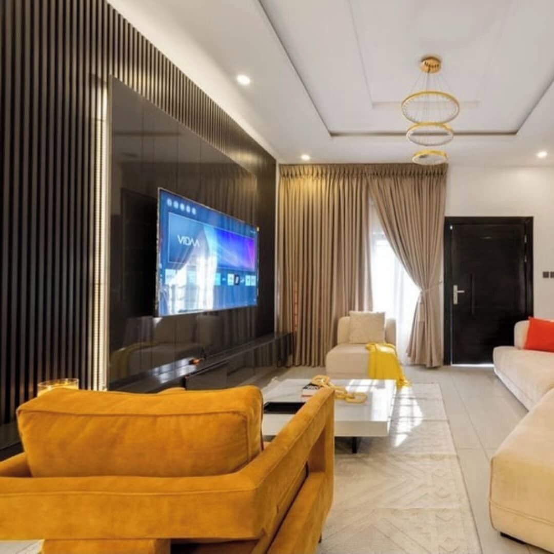 Departamento Deluxe, balcón, vista a la ciudad | Área de sala de estar