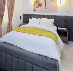 Economy Room, Balcony, City View | Desk, laptop workspace, blackout drapes, soundproofing