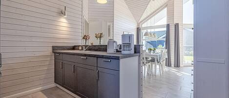 Fridge, stovetop, dishwasher, coffee/tea maker