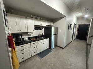 Microwave, coffee/tea maker, cookware/dishes/utensils, paper towels