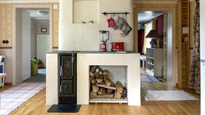A compact kitchen with a built-in stove, a blender, and a hanging pot rack. - 2 bedroom awesome home in Arboga (Arboga)