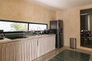 Fridge, microwave, stovetop, coffee/tea maker