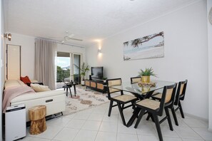 Deluxe Apartment, Balcony, Sea View | Living room - Tropical Comfort Pool and Esplanade View (Cairns North)