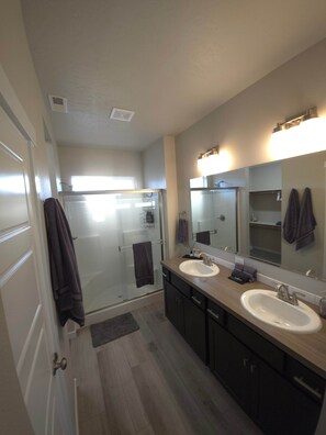 Shower, hair dryer, towels, soap