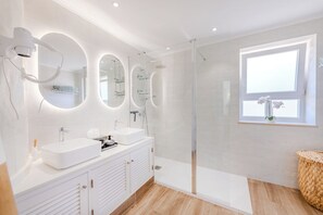 Shower, hair dryer, towels, soap