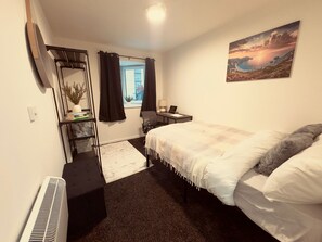 Economy Double Room | Desk, laptop workspace, blackout drapes, iron/ironing board