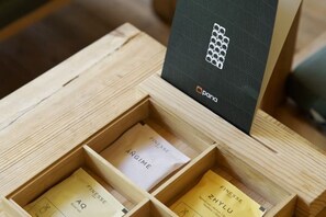 A wooden box with compartments containing items labeled 'FINESSE' and 'ANGIME'. - Pana Ayusai (Almaty)
