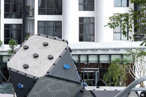 A modern building with a geometric facade and a flat roof. - Grace Suite @ The Shore Kota Kinabalu (Kota Kinabalu)
