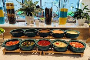 A buffet with various food items and drinks. - The Cam Ranh Oceanview (Cam Ranh)