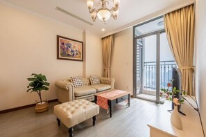 Living area - Cozy Haven Apartment - Vinhomes Central Park (Ho Chi Minh City)