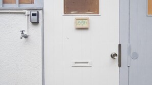 A white door with a small window and a doorbell. - PIER & JETTY - Shiratori 2 (Osaka)