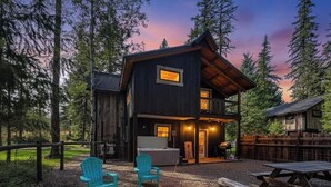 A cabin with a fire pit, outdoor seating, and a deck. - The Solace by Bison Ridge Retreat (Whitefish)