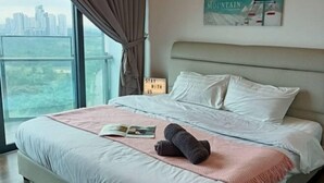 A bedroom with a bed, a window with curtains, a sign with a motivational message, and a wall-mounted picture. - C2011 Almas Suites Studio Netflix Johor by STAY (Iskandar Puteri)