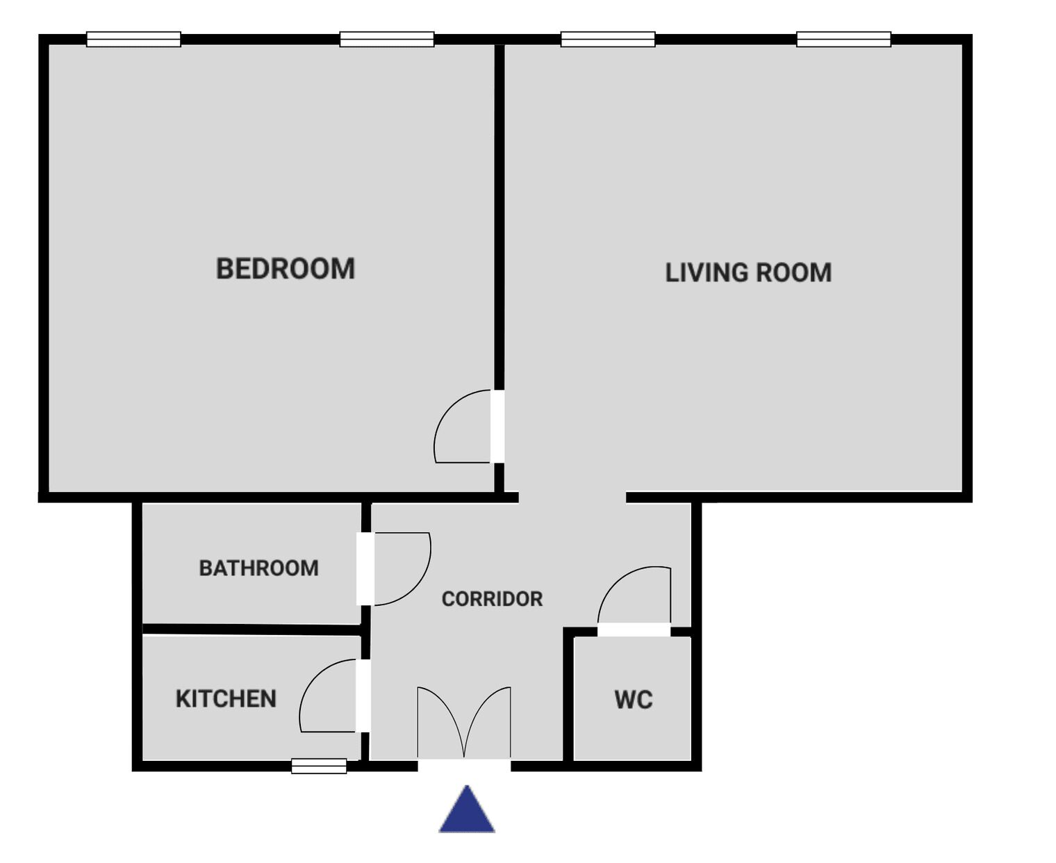 Un plan d’étage comprenant une chambre, un salon, une salle de bain, une cuisine et des toilettes.