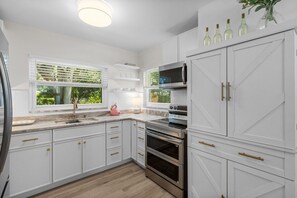 Fridge, microwave, oven, stovetop - Flamingos Nest - Madeira Beach Pool Home with private Guest House (St. Petersburg)