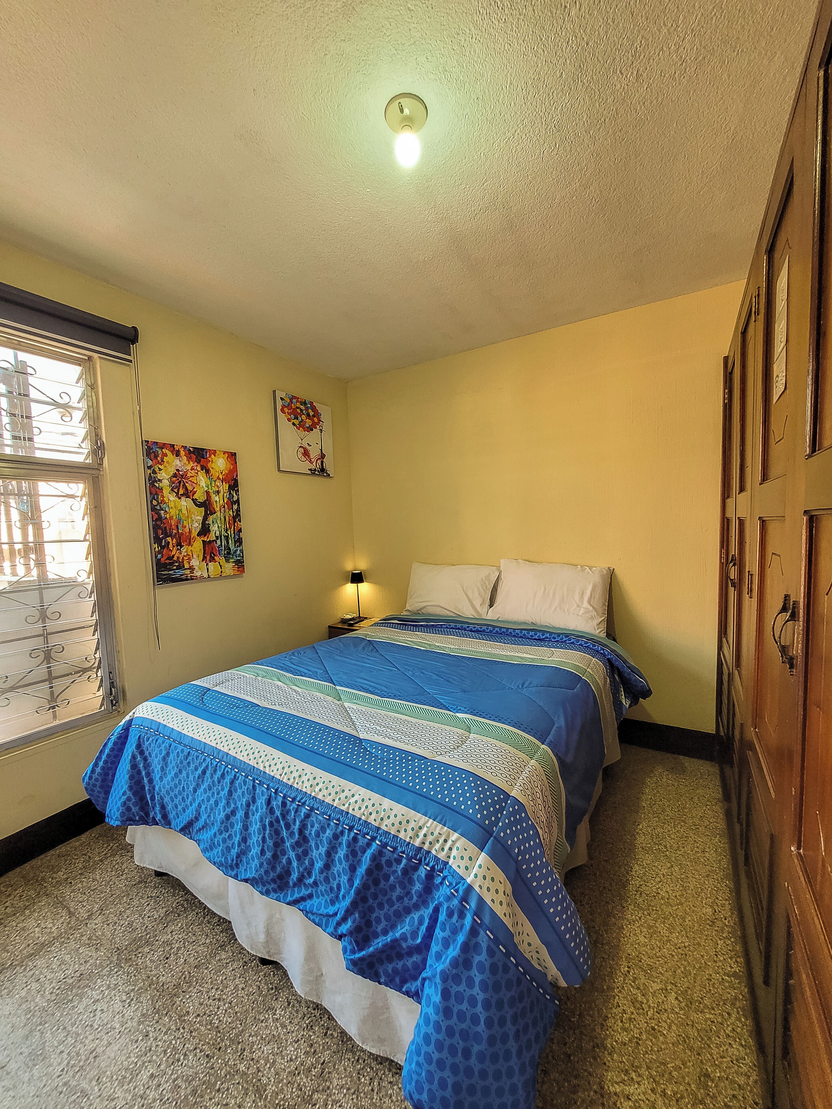 Basic Double Room, 1 Queen Bed, Shared Bathroom | Free WiFi, bed sheets
