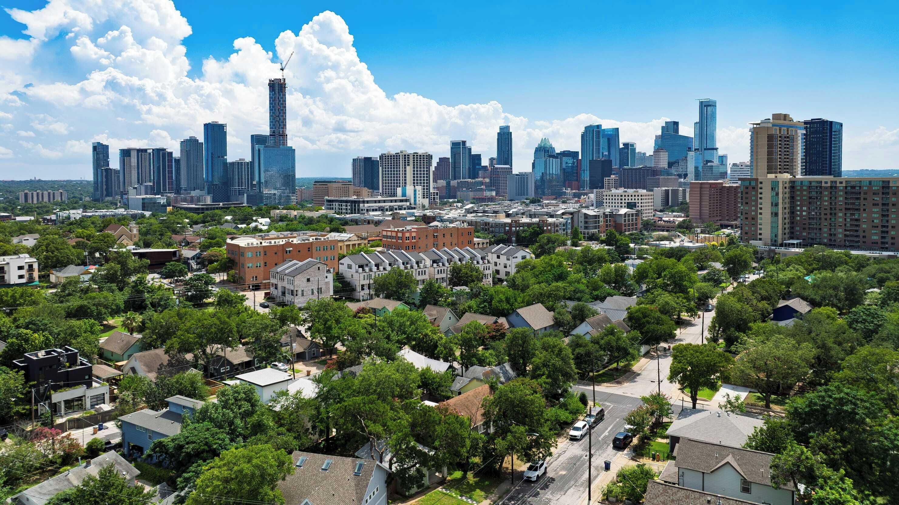 A cityscape with a mix of high-rise buildings and residential areas.