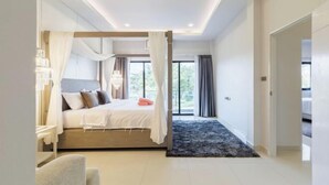 A modern bedroom with a canopy bed, a small bedside table, and a view of the outdoors. - Pattaya detached four-bedroom five-bed room pool villa (Pattaya)