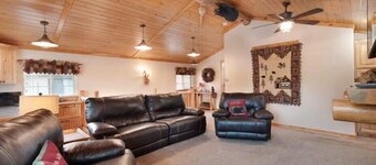 Beautiful lakefront property with large yard, private hot tub, furnished deck and game room!
