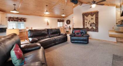 Beautiful lakefront property with large yard, private hot tub, furnished deck and game room!