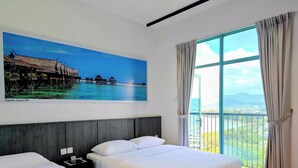 A hotel room with two beds, a large window with curtains, a painting of a coastal scene, and a balcony with a view. - Bay Win La.mer Butik (Kota Kinabalu)