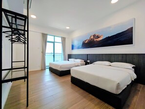A hotel room with two beds, a large window with curtains, a metal rack, and a painting on the wall. - Bay Win La.mer Butik (Kota Kinabalu)