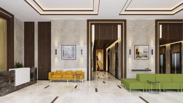A modern lobby with a reception desk, yellow and green sofas, and framed artwork on the walls. - MIN' Apartment - Rivergate Residence Downtown BUI VIEN - FREE POOL (Ho Chi Minh City)