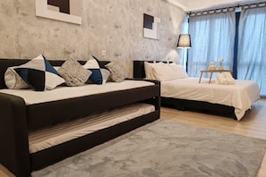 A modern bedroom with a sofa bed, a separate bed, a bedside table, and a lamp. - Pavillion Bukit Jalil 【Walk 2 mins】Stylish Lily Studio 2-4 Pax (Kuala Lumpur)