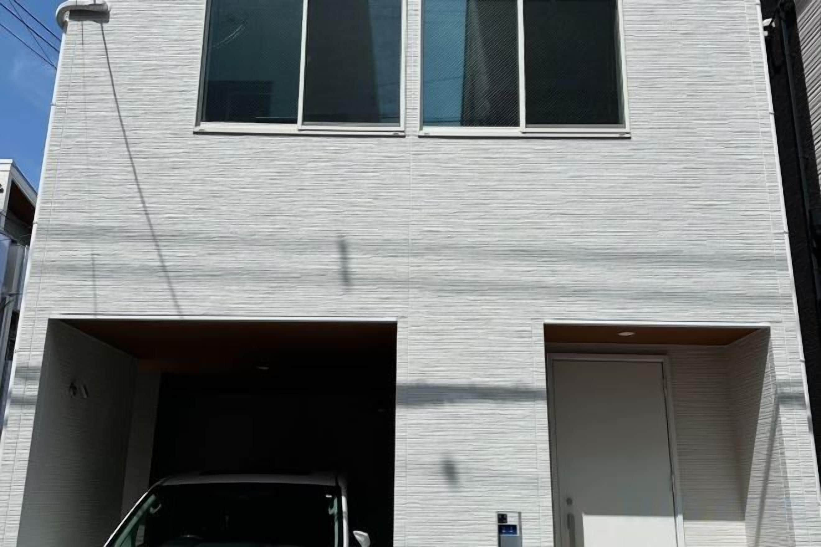 A building with a garage entrance and a door.
