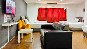 A hotel room with a bed, a sofa, a TV, and a desk. - Hotel Traveler's Majestic Retreat, Located in the Heart of Melaka (Melaka)