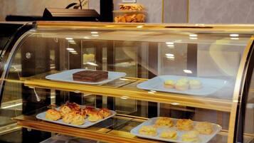 A bakery display case with various baked goods.
