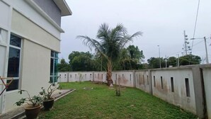 A modern building with a flat roof and large windows.