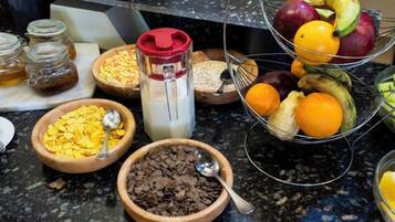 A kitchen counter with various food items and containers.