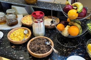 A kitchen counter with various food items and containers. - Al Dora All Inclusive Hotel (Hurghada)