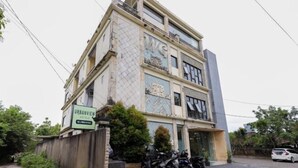 A multi-story building with a sign for "URBANVIEW HOTEL" and a "WC" sign above the entrance. - Urbanview Hotel WG Jimbaran Bali (Bali)