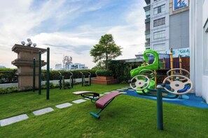A playground with a slide, swings, and climbing structures. - Luxury Apartment in Central_Luminous Leman (Ho Chi Minh City)