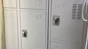 A row of metal lockers with numbers 2, 5, 8, and 9 visible. - Rovers Hostel (Dubai)