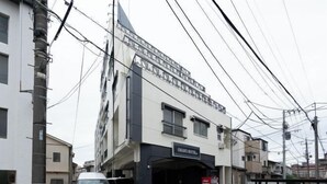 A hotel with a sign reading "OHAYO HOTEL" on a multi-story building with a modern design. - OHAYO Hotel・Kami-Itabash (Tokyo)