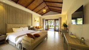 A bedroom with a large bed, a sofa, a desk, and a TV. - Sao Mai Resort (Tuy Hoa)