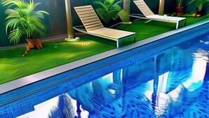A poolside area with lounge chairs, potted plants, and a clear view of the pool. - JJH Serviced Apartments Near Serangoon MRT (Singapore)