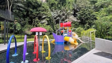 A water play area with slides and a pool.