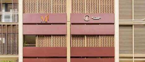 A multi-story building with a prominent 'W Hotel Complex' sign.
