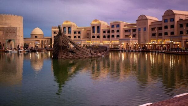 A waterfront hotel with a large central water feature, reflecting the architecture. - KARAVANSARAY Turkistan Family Hotel - Free FLYING THEATRE Entrance (Turkistan)