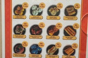 A menu with various dishes and their prices. - Windmills Upon Hills Hotels & Residences Genting Highland (Genting Highlands)