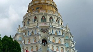 A multi-tiered, ornate building with a central spire and multiple balconies. - The Ceo Executive Loft - Work & Play (Bayan Lepas)