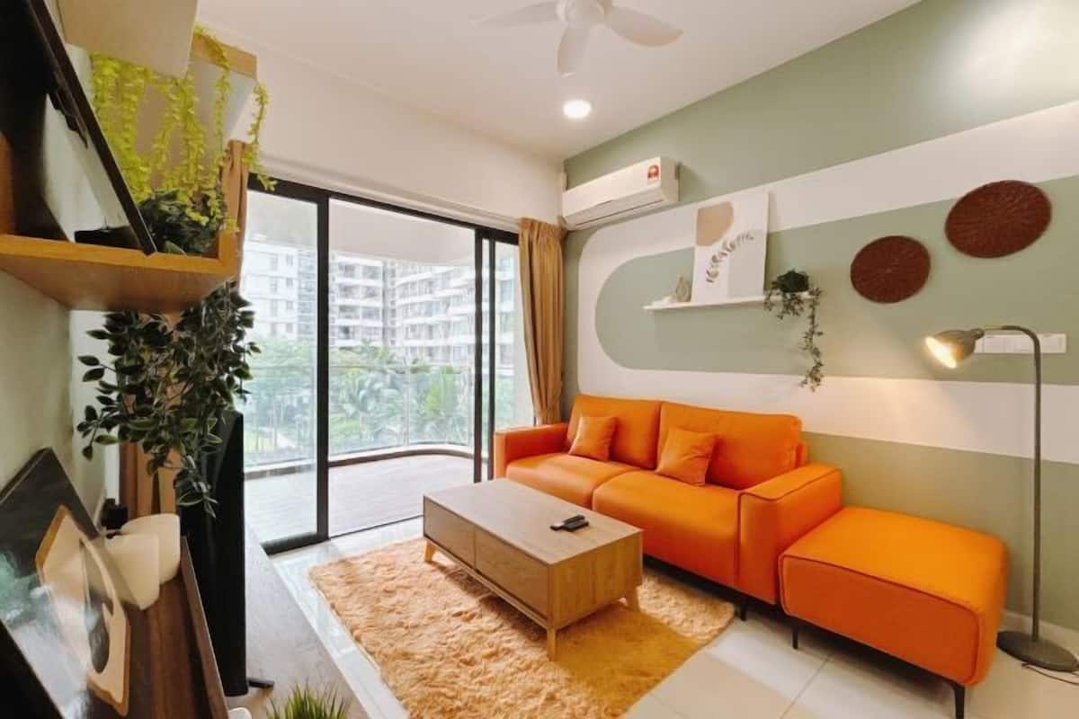A modern living room with a sofa, coffee table, and a large window.