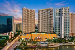 A high-rise building complex with a central building featuring a large sign. - Luxury Serviced Apartment Vinhomes D’Capitale Hanoi – Zen Homes (Hanoi)