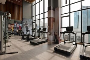 A gym with treadmills, elliptical machines, and weight equipment. - Luxury Serviced Apartment Vinhomes D’Capitale Hanoi – Zen Homes (Hanoi)